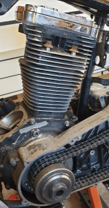 Harley Evolution engine disassembled for repair, showing parts commonly linked to issues in problematic Evo years.